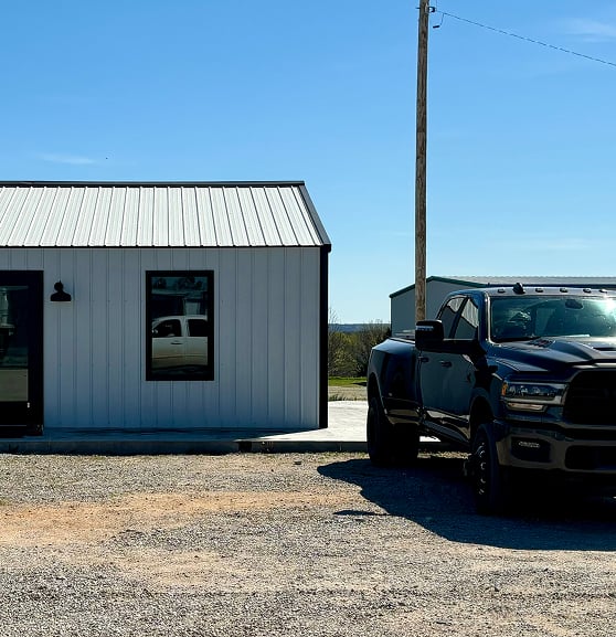 truck next to a metal building